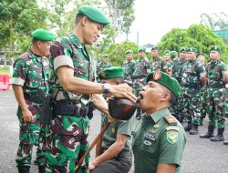 Letkol Inf Rinto Wijaya S.A.P., M.I.POL., M.HAN Pimpin Tradisi Penerimaan dan Pelepasan Anggota Kodim 0422/Lampung Barat